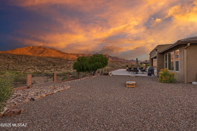 35605 S Overlook Dr, Saddlebrooke, AZ 85739 - view of yard featuring fence, a mountain view, and a patio