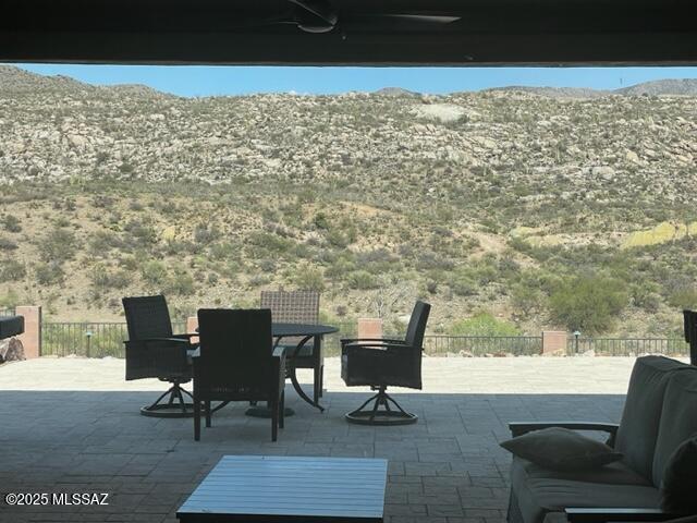 35605 S Overlook Dr, Saddlebrooke, AZ 85739 - view of patio / terrace with outdoor dining space and a mountain view