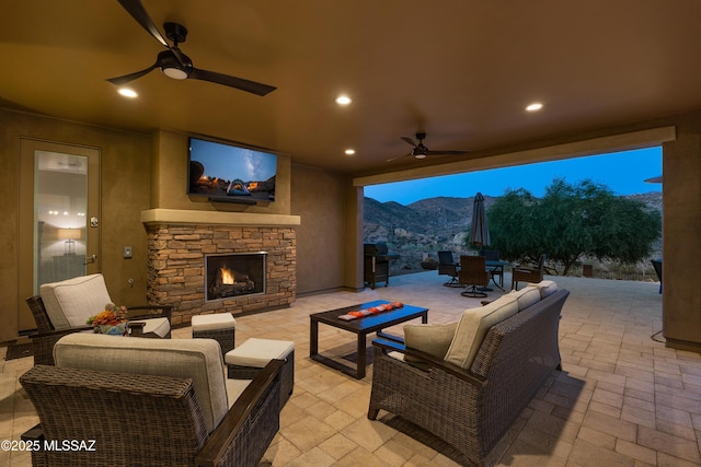 35605 S Overlook Dr, Saddlebrooke, AZ 85739 - view of patio with outdoor dining area, ceiling fan, and an outdoor living space with a fireplace