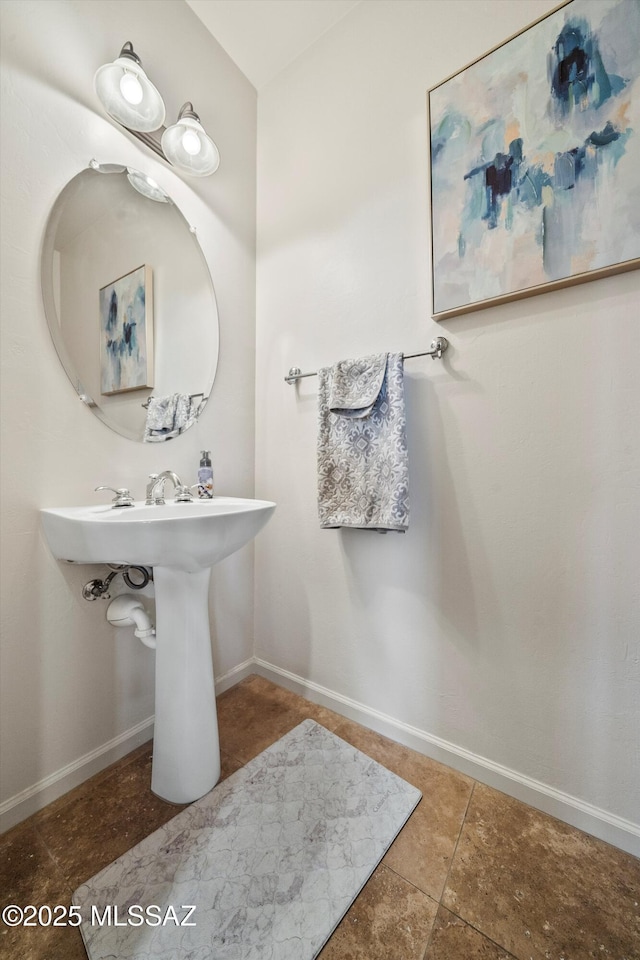 bathroom featuring tile patterned floors and baseboards