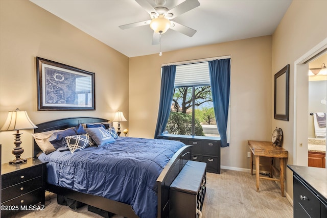 bedroom featuring baseboards, a ceiling fan, and light carpet