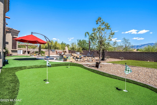 view of home's community with a fenced backyard and a patio