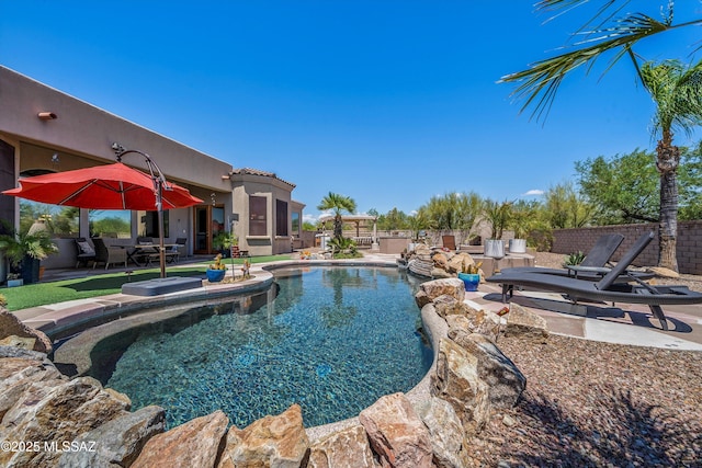 view of pool featuring a fenced in pool and a patio