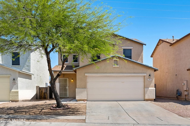 1985 S Mcconnell Dr, Tucson, AZ 85710 - traditional-style home with a garage, driveway, and stucco siding