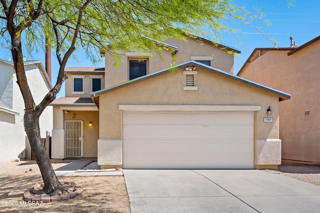 1985 S Mcconnell Dr, Tucson, AZ 85710 - traditional-style home with concrete driveway, stucco siding, and a garage