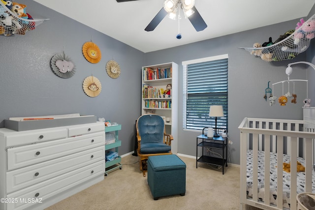 1985 S Mcconnell Dr, Tucson, AZ 85710 - bedroom with a nursery area, baseboards, ceiling fan, and light colored carpet