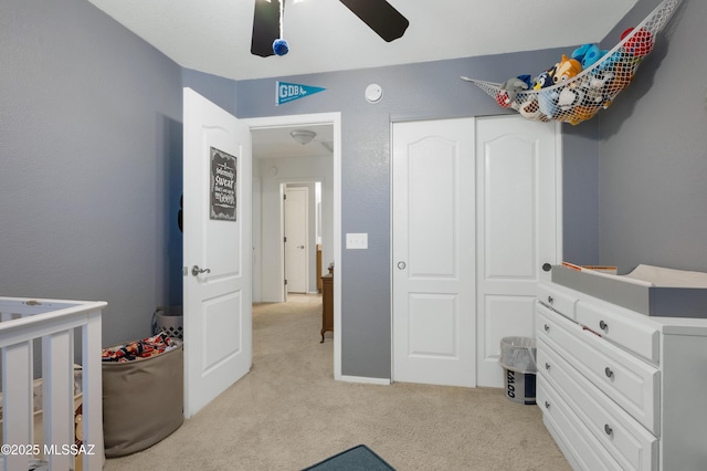 1985 S Mcconnell Dr, Tucson, AZ 85710 - bedroom featuring a closet, light colored carpet, and a ceiling fan