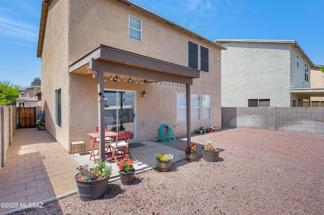 1985 S Mcconnell Dr, Tucson, AZ 85710 - back of house featuring a patio area, stucco siding, and a fenced backyard