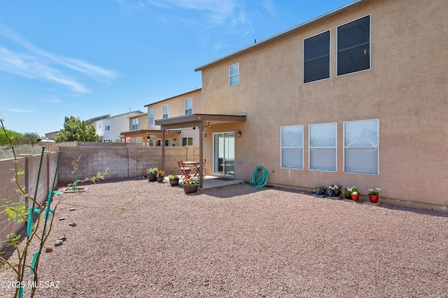 1985 S Mcconnell Dr, Tucson, AZ 85710 - back of property with a patio, a fenced backyard, and stucco siding