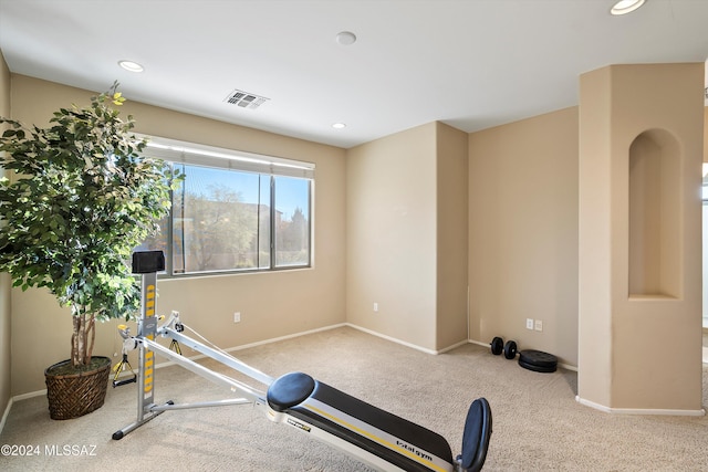 workout room with baseboards, recessed lighting, carpet floors, visible vents, and arched walkways