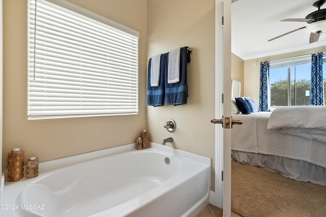 ensuite bathroom with crown molding, a ceiling fan, ensuite bath, and a garden tub