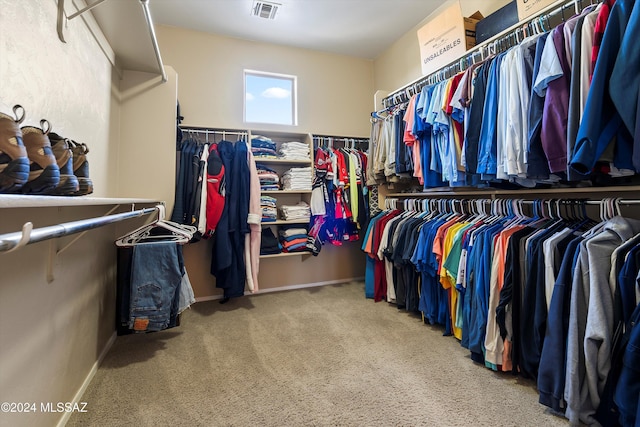 spacious closet with visible vents and carpet flooring