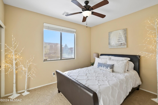 bedroom with visible vents, baseboards, a ceiling fan, and carpet floors