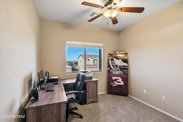 office area with light carpet, visible vents, baseboards, and ceiling fan