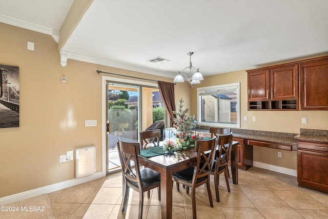 dining room with light tile patterned floors, ornamental molding, visible vents, a chandelier, and baseboards