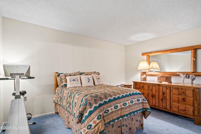 carpeted bedroom featuring a textured ceiling