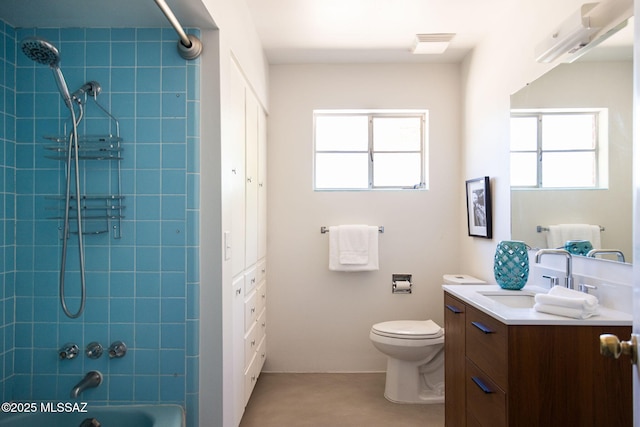 bathroom featuring plenty of natural light, shower / bathing tub combination, toilet, and vanity