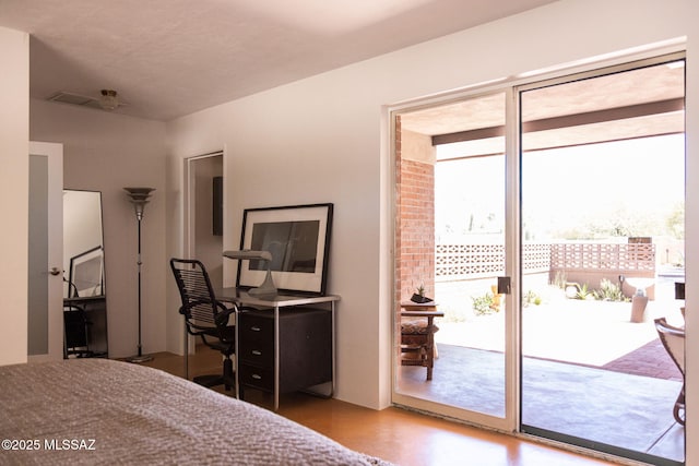 bedroom featuring access to outside