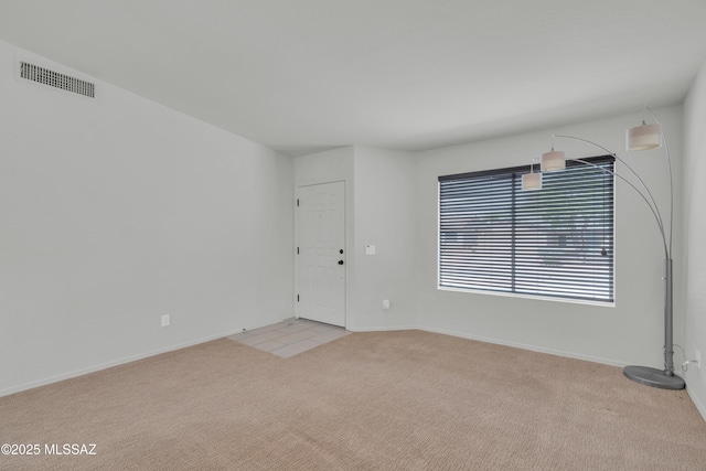 8972 E Mcmurray Pl, Tucson, AZ 85730 - spare room with light colored carpet and baseboards
