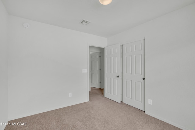 8972 E Mcmurray Pl, Tucson, AZ 85730 - unfurnished bedroom featuring carpet flooring, a closet, and baseboards