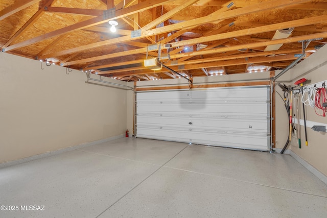 8972 E Mcmurray Pl, Tucson, AZ 85730 - garage featuring baseboards and a garage door opener