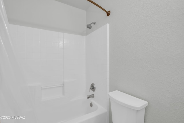 8972 E Mcmurray Pl, Tucson, AZ 85730 - bathroom with shower / bathtub combination, toilet, and a textured wall