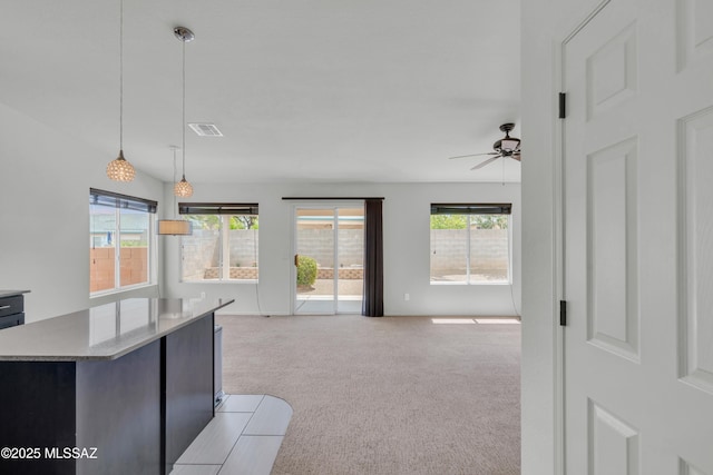 8972 E Mcmurray Pl, Tucson, AZ 85730 - living room with light carpet and ceiling fan