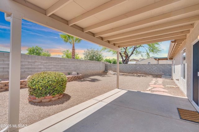 8972 E Mcmurray Pl, Tucson, AZ 85730 - patio terrace at dusk featuring a patio area and a fenced backyard