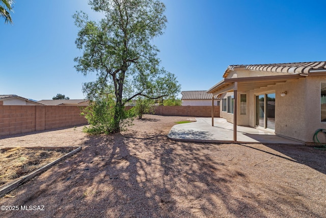 view of yard featuring a fenced backyard and a patio area