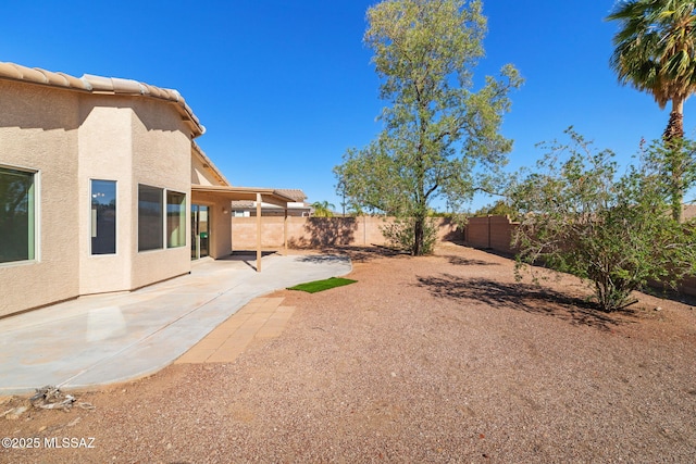 view of yard with a patio and a fenced backyard