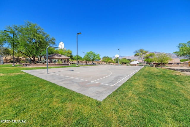 view of basketball court featuring a lawn, a gazebo, and community basketball court