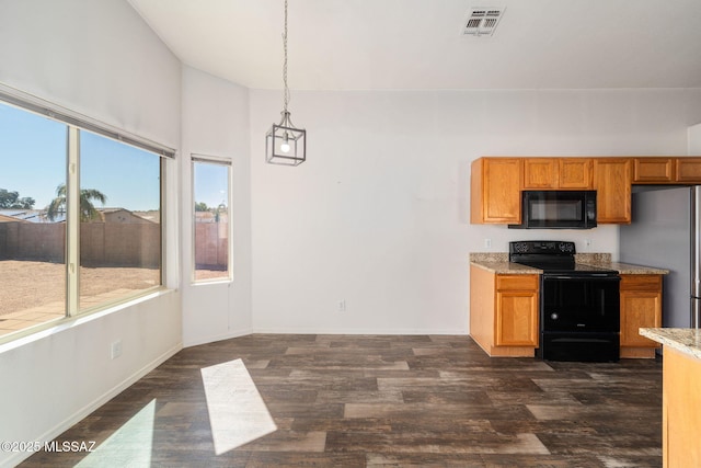kitchen featuring visible vents, brown cabinetry, dark wood-type flooring, vaulted ceiling, and black appliances