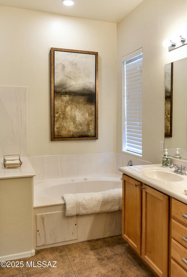 full bath with a bath, tile patterned flooring, and vanity