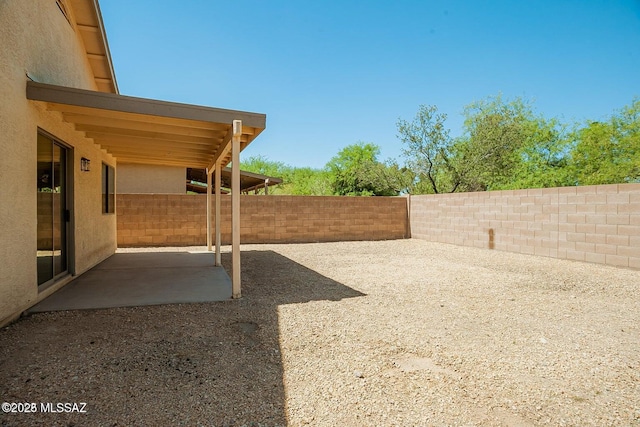 view of yard featuring a fenced backyard and a patio