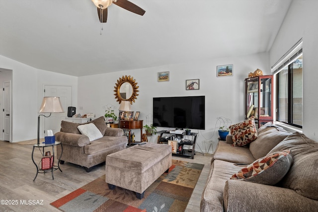 living room with light wood-style floors and ceiling fan