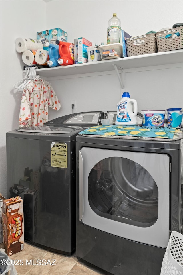 laundry room with independent washer and dryer and laundry area