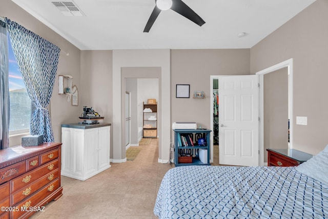bedroom with visible vents, ceiling fan, light tile patterned flooring, and baseboards
