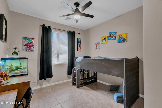 bedroom featuring tile patterned flooring, visible vents, baseboards, and ceiling fan