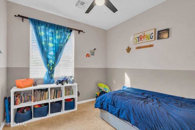 bedroom with visible vents, tile patterned floors, a ceiling fan, and baseboards