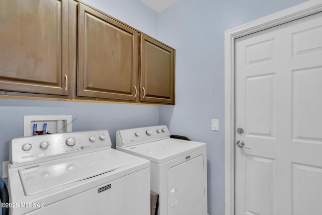 washroom with cabinet space and independent washer and dryer