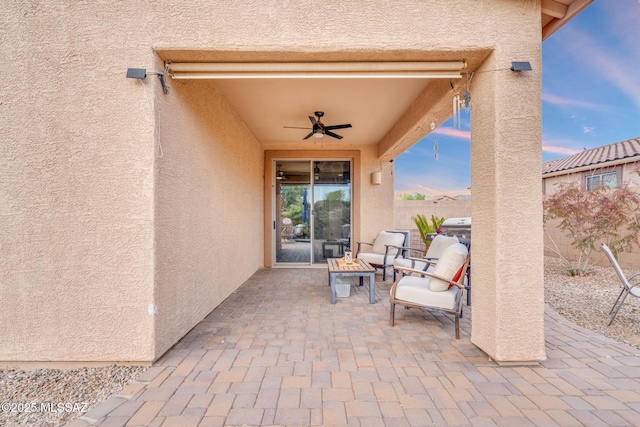 view of patio with ceiling fan and fence