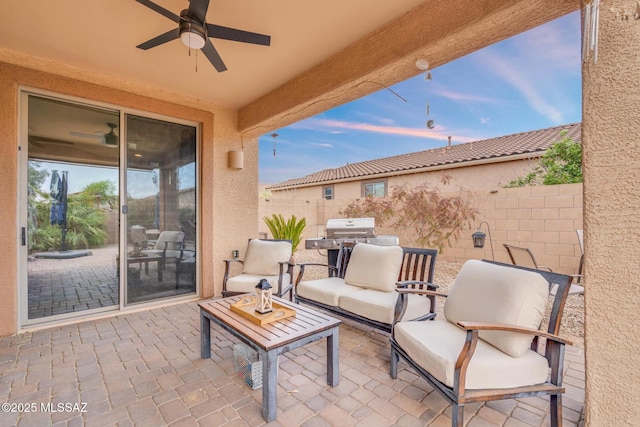 view of patio / terrace featuring an outdoor hangout area, fence, area for grilling, and ceiling fan