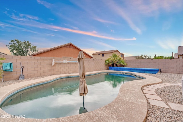 view of swimming pool featuring a fenced in pool and a fenced backyard
