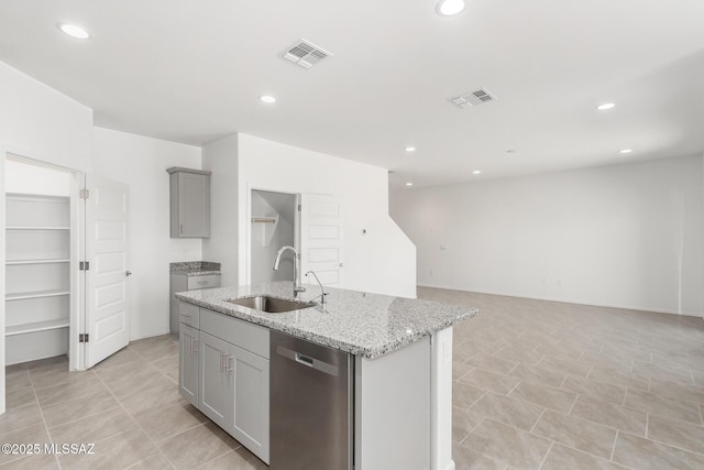 kitchen with visible vents, a sink, recessed lighting, gray cabinets, and stainless steel dishwasher
