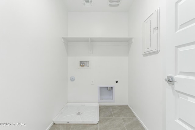 washroom with visible vents, baseboards, washer hookup, laundry area, and light tile patterned flooring