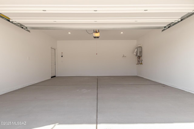 garage with water heater, recessed lighting, and a garage door opener