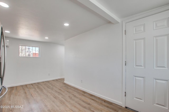 below grade area with baseboards, recessed lighting, and light wood-style floors