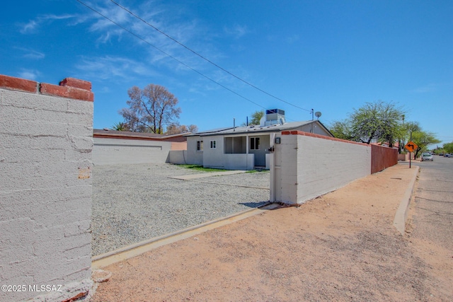 back of house featuring fence