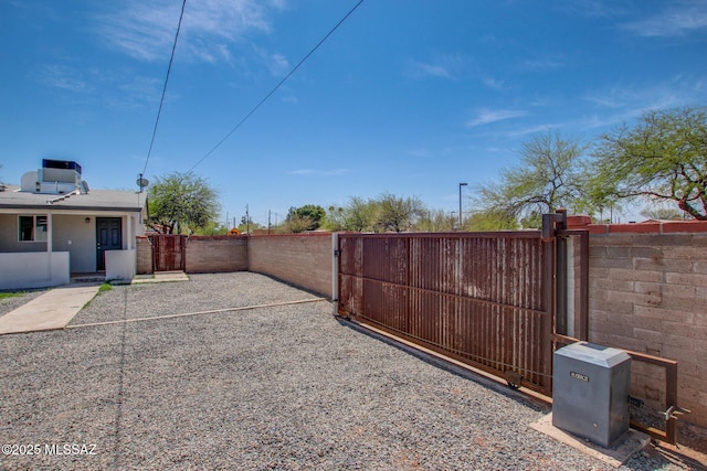 view of gate with fence