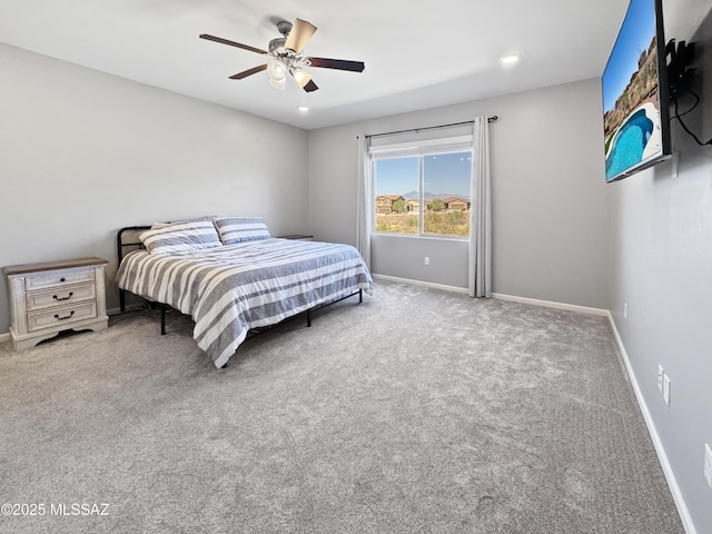 bedroom with carpet floors, baseboards, and ceiling fan